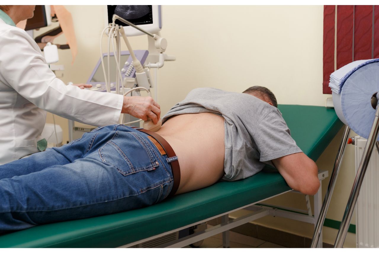 A doctor doing an ultrasound on a  sciatica patient