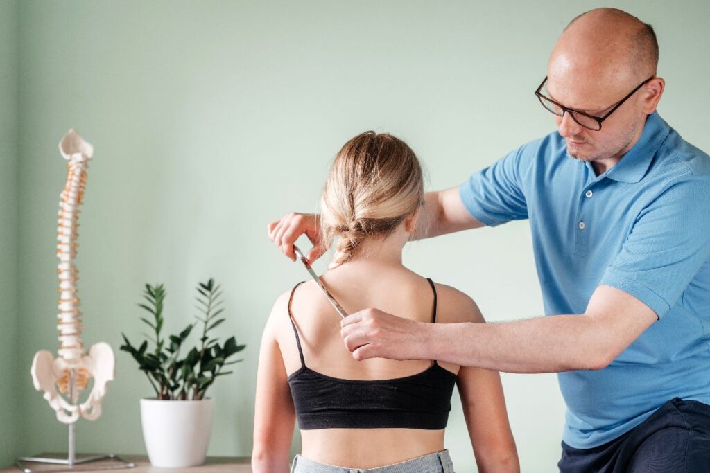 A patient being treated by a chiropractor