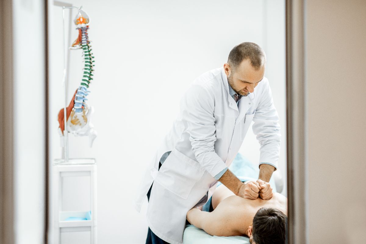 A patient being treated by a chiropractor